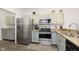 Well-equipped kitchen featuring stainless steel appliances and ample cabinetry at 2811 Grandview Ln, Greenwood, IN 46143