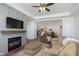 Open living room featuring a fireplace, comfortable seating, and views into the kitchen at 2811 Grandview Ln, Greenwood, IN 46143