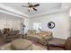 Bright living room with hardwood floors, comfy seating and a view of the dining area at 2811 Grandview Ln, Greenwood, IN 46143