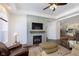 Living room with fireplace, TV, and access to kitchen at 2811 Grandview Ln, Greenwood, IN 46143
