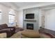 Cozy living room with fireplace, comfortable seating, and hardwood floors at 2811 Grandview Ln, Greenwood, IN 46143