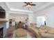 Spacious living room with open concept layout, comfortable seating and a ceiling fan at 2811 Grandview Ln, Greenwood, IN 46143