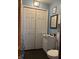 Clean bathroom with white vanity, toilet and large closet at 2920 Newhart St, Indianapolis, IN 46217