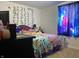 Bedroom with galaxy curtains, and Lilo and Stitch decor at 2920 Newhart St, Indianapolis, IN 46217