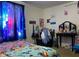 Vibrant bedroom with galaxy curtains and Lilo and Stitch bedding at 2920 Newhart St, Indianapolis, IN 46217