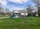 Charming single-story home with stone accents and a cozy front porch, nestled on a spacious lot at 2920 Newhart St, Indianapolis, IN 46217
