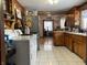 Kitchen with wood cabinets and tile floor at 2920 Newhart St, Indianapolis, IN 46217