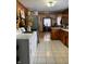 Kitchen with wood cabinets and tile floor at 2920 Newhart St, Indianapolis, IN 46217