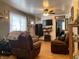 Living room with brown couches and wood floors at 2920 Newhart St, Indianapolis, IN 46217