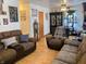 Living room with brown couches and wood floors at 2920 Newhart St, Indianapolis, IN 46217