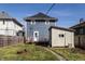 Backyard featuring a deck, shed, and fire pit area, perfect for outdoor relaxation at 404 N Gray St, Indianapolis, IN 46201