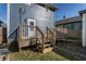 Wooden deck with stairs leading to the backyard, ideal for relaxing and enjoying the outdoors at 404 N Gray St, Indianapolis, IN 46201