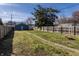 Backyard featuring a shed, woodpile, and fenced perimeter, perfect for hobbies at 404 N Gray St, Indianapolis, IN 46201