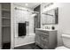Modern bathroom features subway tile, glass shower door and dark tile flooring at 404 N Gray St, Indianapolis, IN 46201