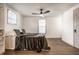 Comfortable bedroom featuring hardwood floors, neutral tones, and abundant natural light at 404 N Gray St, Indianapolis, IN 46201