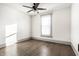 Bright bedroom with wood floors, ceiling fan and a window providing lots of natural light at 404 N Gray St, Indianapolis, IN 46201