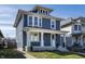 Beautiful two-story home with inviting front porch, bay windows, and landscaped front yard at 404 N Gray St, Indianapolis, IN 46201
