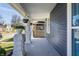 Inviting front porch with classic columns and hanging flower baskets at 404 N Gray St, Indianapolis, IN 46201