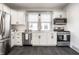 Modern kitchen with white cabinets, stainless steel appliances, and sleek countertops at 404 N Gray St, Indianapolis, IN 46201