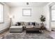 Cozy living room with a plush gray sectional, soft rug, and ample natural light at 404 N Gray St, Indianapolis, IN 46201