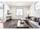 Inviting living room with a gray sectional sofa, stylish coffee table, and neutral decor at 404 N Gray St, Indianapolis, IN 46201