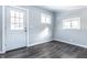 A well-lit room with vinyl plank flooring, neutral walls, and ample natural light at 404 N Gray St, Indianapolis, IN 46201