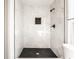 New bathroom with marble tiling and modern fixtures in a spacious shower at 404 N Gray St, Indianapolis, IN 46201