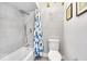 Clean bathroom with shower and blue shower curtain at 5229 Marott Ct, Indianapolis, IN 46226