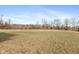 View of the expansive backyard, offering plenty of space for outdoor activities and recreation at 7414 Glen Park Way, Indianapolis, IN 46259