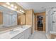 The bathroom features double sinks, a stand up shower, and access to the closet at 7414 Glen Park Way, Indianapolis, IN 46259