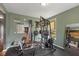 Home gym with full weight set equipment and a mirrored wall at 7414 Glen Park Way, Indianapolis, IN 46259