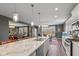 Spacious kitchen features a center island, stainless steel appliances, and an open floor plan at 7414 Glen Park Way, Indianapolis, IN 46259