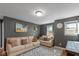 The living room has a large sofa and chairs with a decorative area rug at 7414 Glen Park Way, Indianapolis, IN 46259