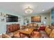 Cozy living room features hardwood floors, ample seating, and elegant decor at 7414 Glen Park Way, Indianapolis, IN 46259