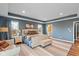 This main bedroom features a decorative area rug, tray ceilings and plenty of light at 7414 Glen Park Way, Indianapolis, IN 46259