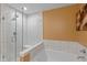 This is a stand up shower featuring sleek tile, glass door and an overhead showerhead at 7414 Glen Park Way, Indianapolis, IN 46259