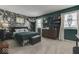 Spacious bedroom with floral wall covering and dark green accents at 8023 Xenia Dr, Indianapolis, IN 46227