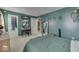Bedroom with green walls, a vanity, and a walk-in closet at 8023 Xenia Dr, Indianapolis, IN 46227
