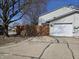Charming home featuring a driveway, garage, and privacy fence at 8023 Xenia Dr, Indianapolis, IN 46227