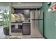 Stainless steel appliances and dark cabinetry in this kitchen at 8023 Xenia Dr, Indianapolis, IN 46227