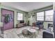 Living room with purple door and gray floors at 8023 Xenia Dr, Indianapolis, IN 46227