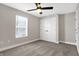 Cozy bedroom featuring carpeted floor, ceiling fan, and a window at 1446 E Naomi St, Indianapolis, IN 46203