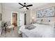 Bright bedroom with carpeted floor, ceiling fan, and large window at 1446 E Naomi St, Indianapolis, IN 46203