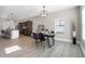 Bright dining area with wood floors and a four-person table at 1446 E Naomi St, Indianapolis, IN 46203