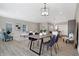 Dining area with a wood table, four chairs, and a large mirror at 1446 E Naomi St, Indianapolis, IN 46203
