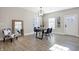 Dining area with a wood table, four chairs, and a large mirror at 1446 E Naomi St, Indianapolis, IN 46203