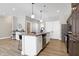 Modern kitchen with stainless steel appliances and an island at 1446 E Naomi St, Indianapolis, IN 46203