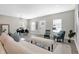Open concept living and dining area with hardwood floors and stylish decor at 1446 E Naomi St, Indianapolis, IN 46203