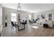Open concept living and dining area with hardwood floors and stylish decor at 1446 E Naomi St, Indianapolis, IN 46203