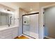 Bathroom featuring a glass-enclosed shower with black hardware, and a white vanity with a stone countertop at 1713 Real St, Indianapolis, IN 46240